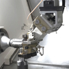 Automated CNC Lathe with Gantry Loading System Integrates machining with automated material handling