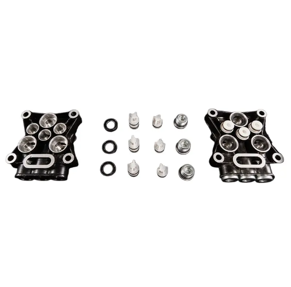 individual components of an industrial plunger pump head before automated assembly